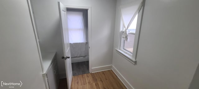 hallway featuring hardwood / wood-style flooring