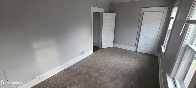 unfurnished bedroom featuring carpet flooring