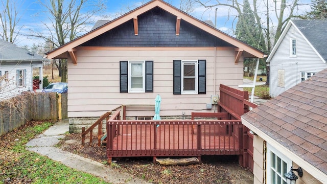 rear view of house featuring a deck