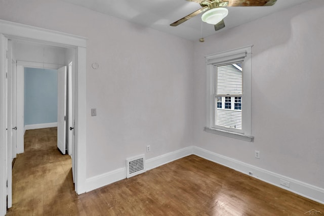 spare room with hardwood / wood-style flooring