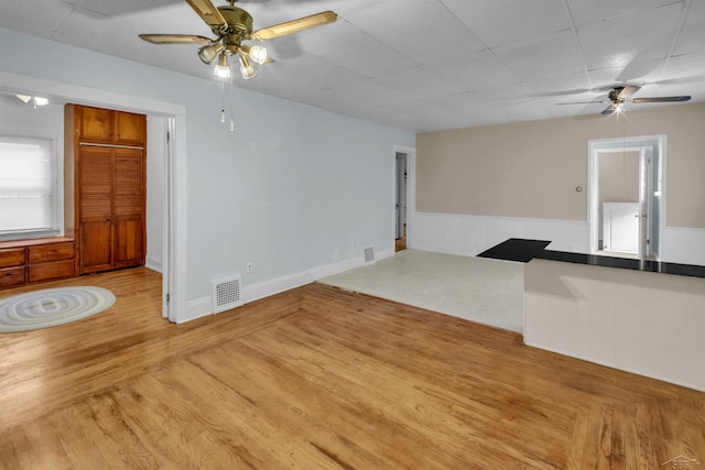 interior space featuring ceiling fan and light hardwood / wood-style flooring