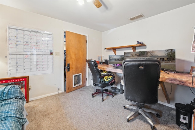 home office featuring ceiling fan and light carpet