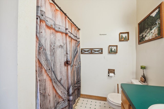 bathroom featuring vanity and toilet