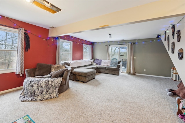 living room with carpet flooring and a healthy amount of sunlight