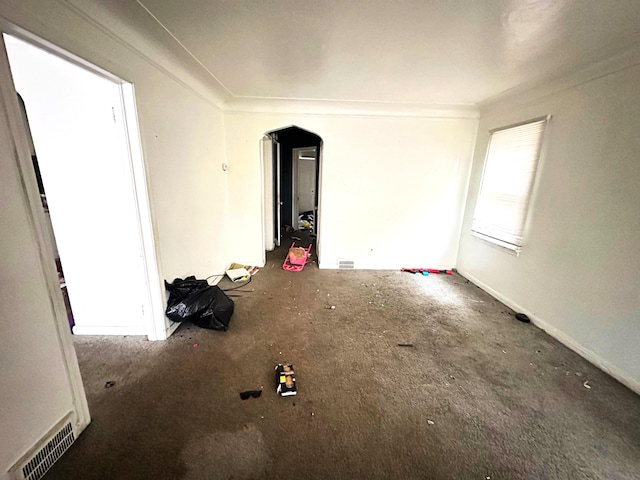 carpeted spare room with crown molding