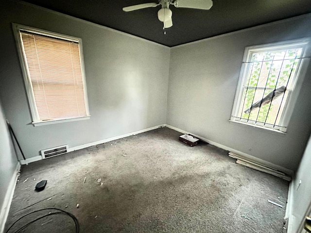 spare room featuring carpet flooring and ceiling fan