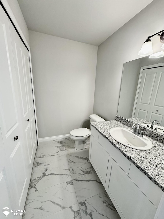 31007 Gregory St, Grand Blanc, MI 48439 - half bath featuring vanity, baseboards, toilet, and marble finish floor