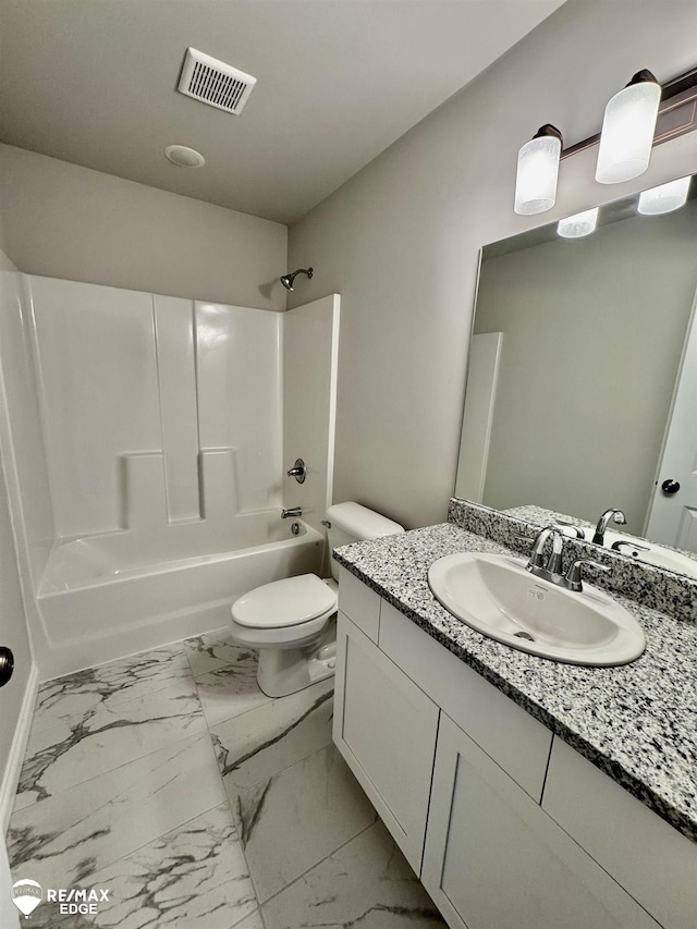 31007 Gregory St, Grand Blanc, MI 48439 - bathroom with visible vents, vanity, marble finish floor, toilet, and  shower combination