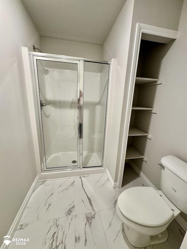 31007 Gregory St, Grand Blanc, MI 48439 - bathroom featuring baseboards, a shower stall, toilet, and marble finish floor