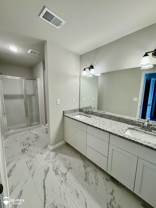 31007 Gregory St, Grand Blanc, MI 48439 - full bath featuring a sink, double vanity, baseboards, a shower stall, and visible vents