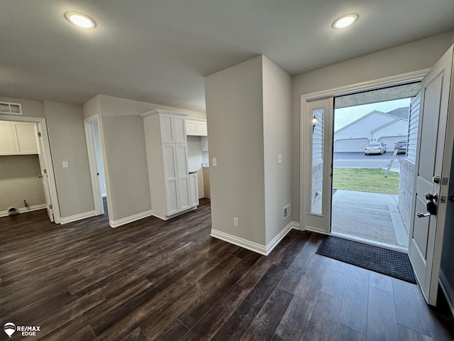 foyer with dark hardwood / wood-style floors