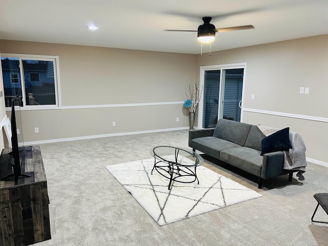 living room with carpet and ceiling fan