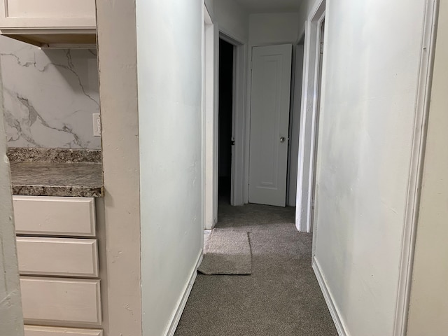 hallway with carpet flooring