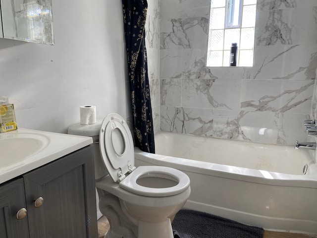 full bathroom featuring vanity, toilet, and shower / tub combo with curtain