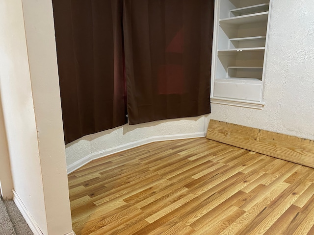 spare room with hardwood / wood-style flooring