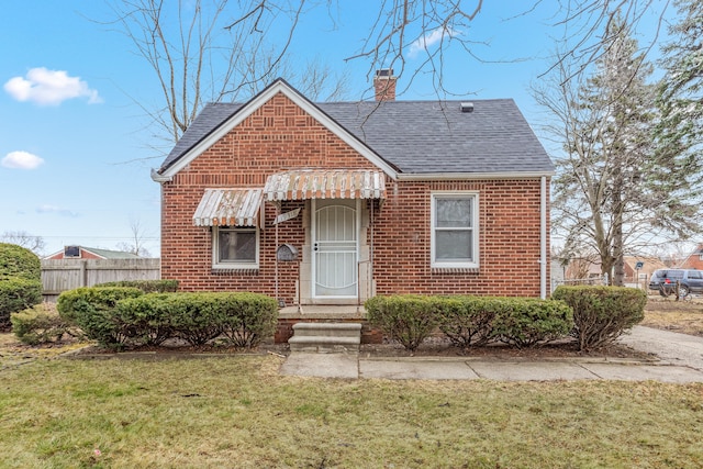 bungalow-style house featuring a front yard