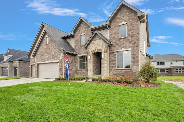 view of front facade with a front yard and a garage