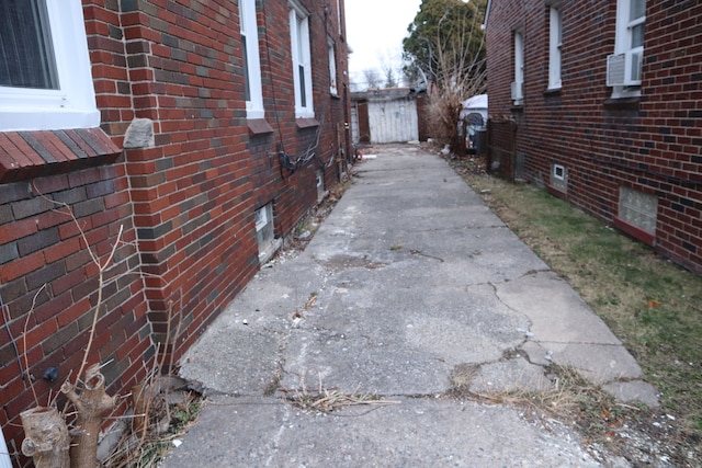 view of home's exterior featuring brick siding and cooling unit