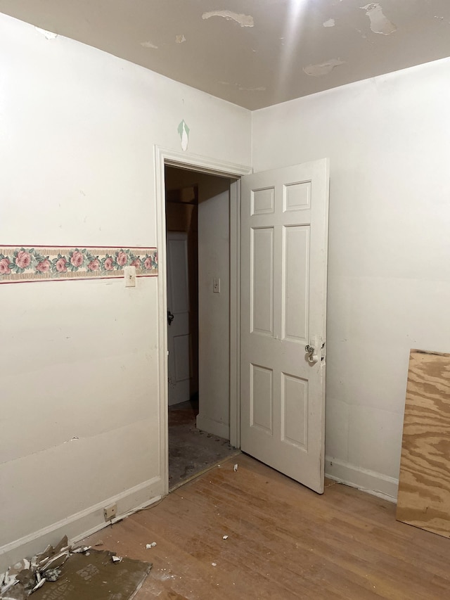 empty room featuring wood finished floors