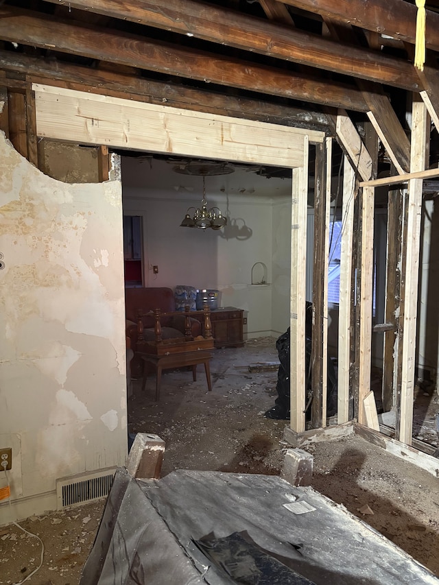 miscellaneous room featuring visible vents and an inviting chandelier