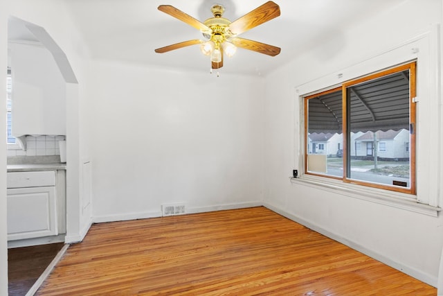 empty room featuring ceiling fan and light hardwood / wood-style floors