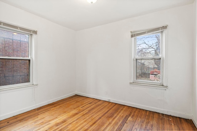 empty room with light hardwood / wood-style floors