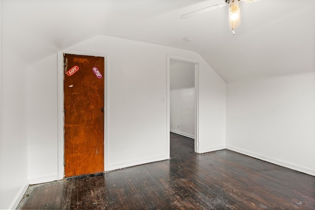 additional living space with dark hardwood / wood-style floors, ceiling fan, and lofted ceiling