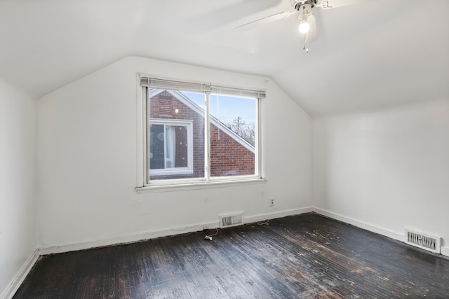 bonus room featuring ceiling fan, dark wood-type flooring, and lofted ceiling