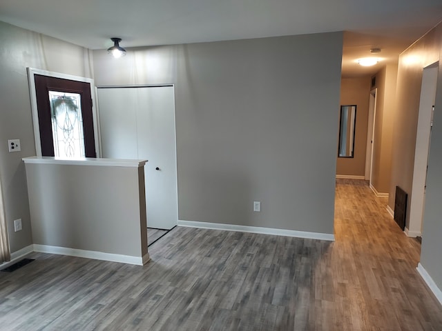 unfurnished room featuring hardwood / wood-style flooring