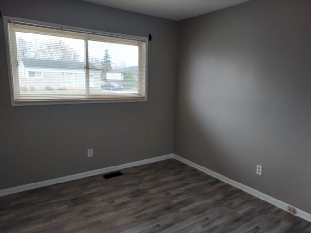 empty room featuring dark hardwood / wood-style floors