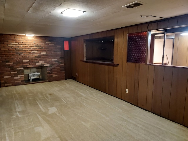 basement with light carpet and wooden walls