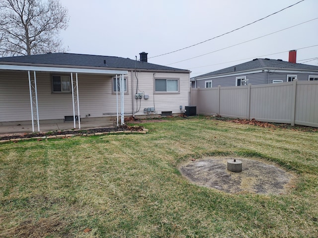 back of property with a lawn, a patio area, and cooling unit