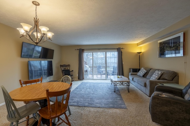 carpeted living room featuring a textured ceiling and an inviting chandelier