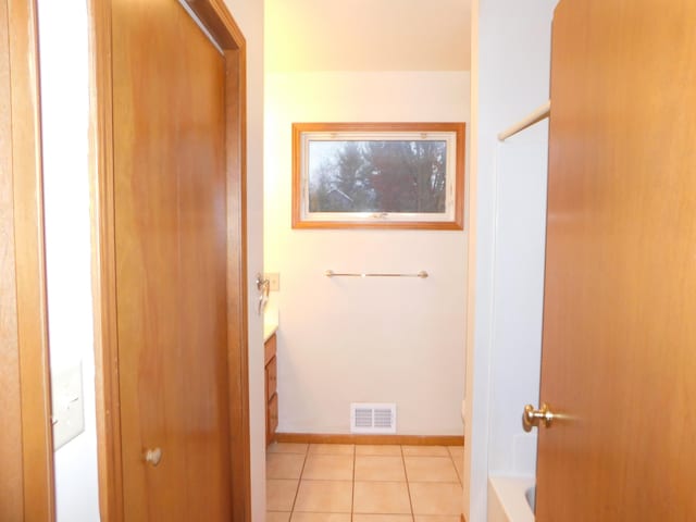 bathroom featuring tile patterned floors and vanity