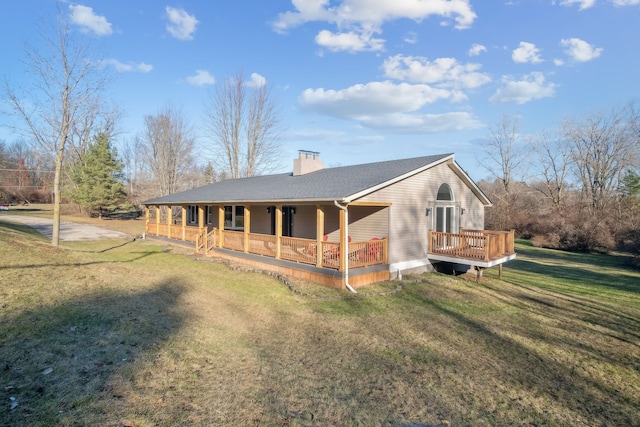 exterior space featuring a lawn and a porch