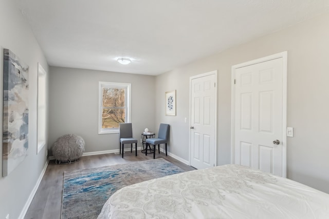 bedroom featuring multiple windows and hardwood / wood-style floors