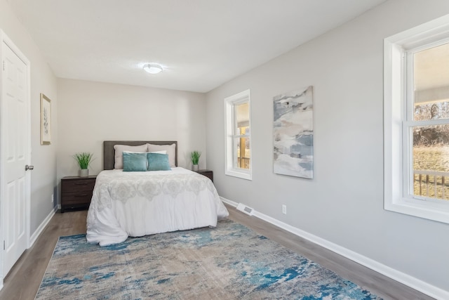 bedroom featuring dark hardwood / wood-style floors