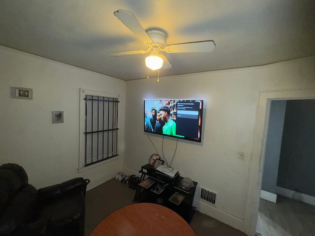 carpeted living room with ceiling fan