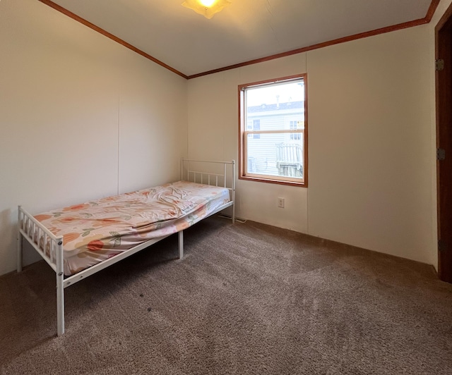 bedroom featuring carpet and crown molding