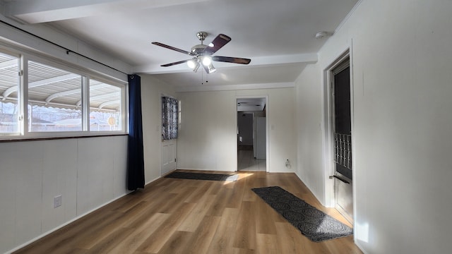 empty room featuring ceiling fan and hardwood / wood-style flooring