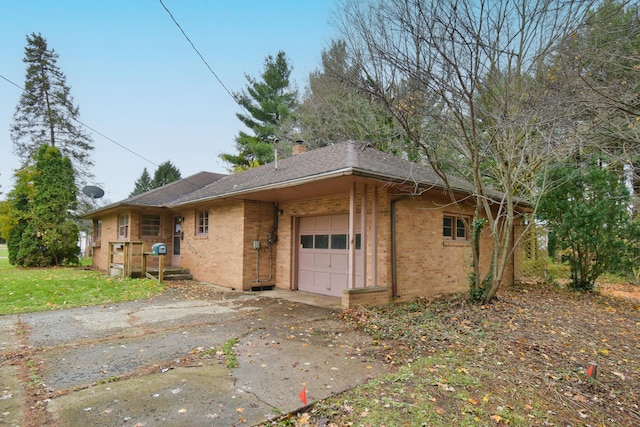 view of side of home featuring a garage