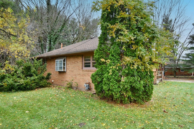 view of property exterior with a yard