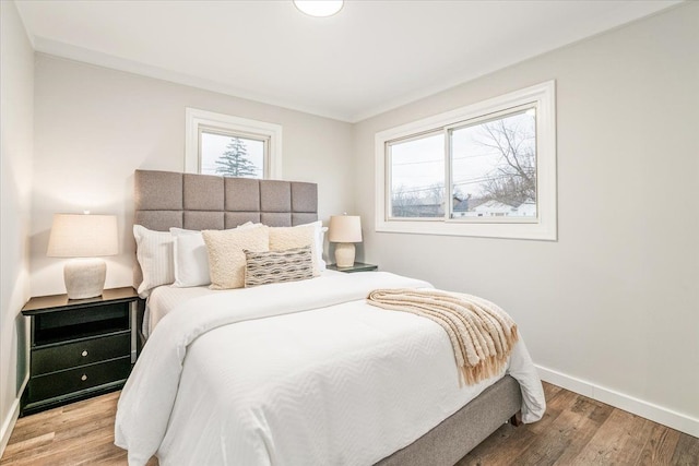 bedroom with light hardwood / wood-style floors