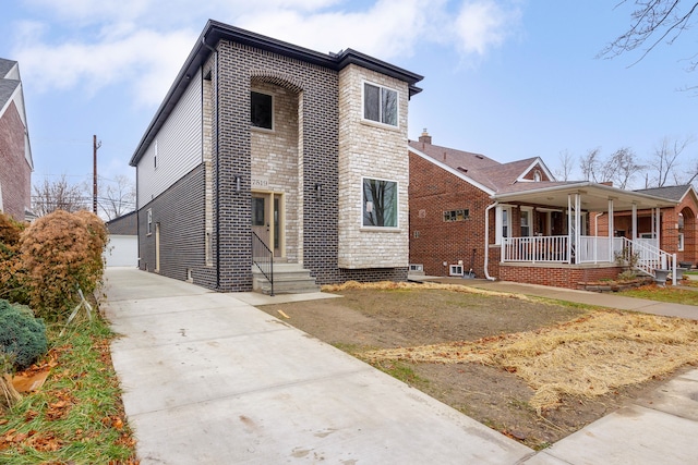 view of front of home featuring a garage and an outdoor structure