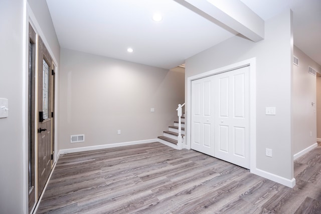 interior space featuring light wood-type flooring and a closet