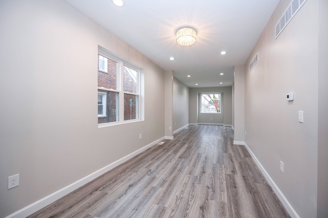 corridor featuring light hardwood / wood-style floors