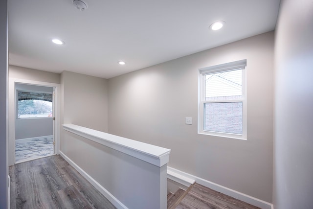 hall with hardwood / wood-style floors