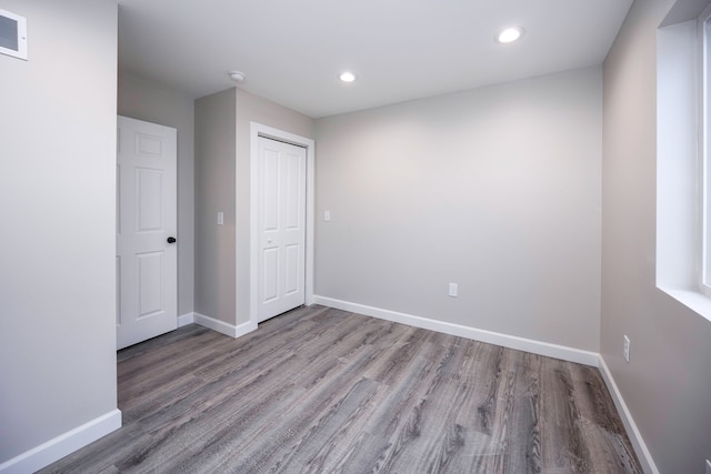 empty room with hardwood / wood-style floors