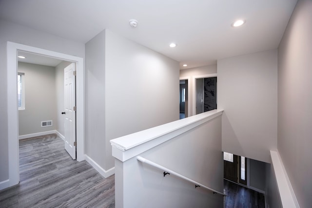 staircase with wood-type flooring