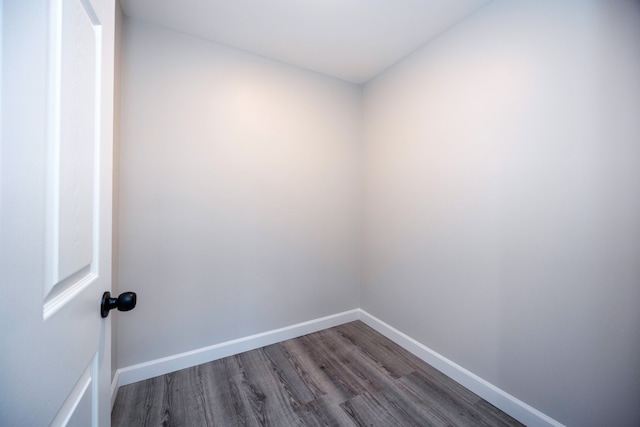 empty room with dark wood-type flooring